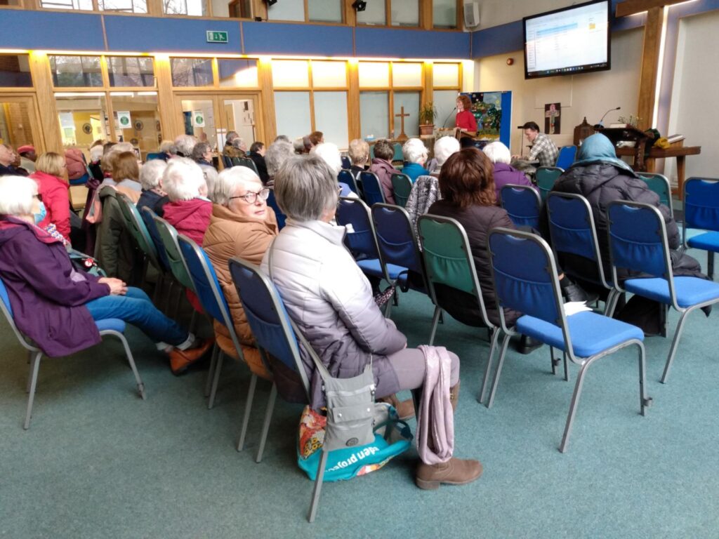 u3a members seated at monthly meeting