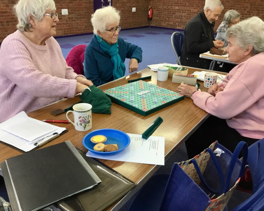 group of people playing scrabble